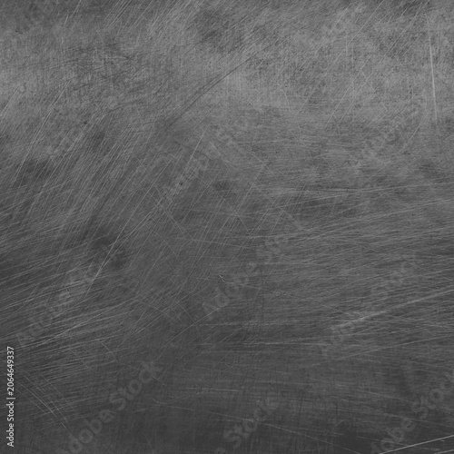 Photos Dark scratched metal texture background with a rugged style