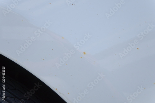 Rust Spots on White Car Surface – Macro Detail