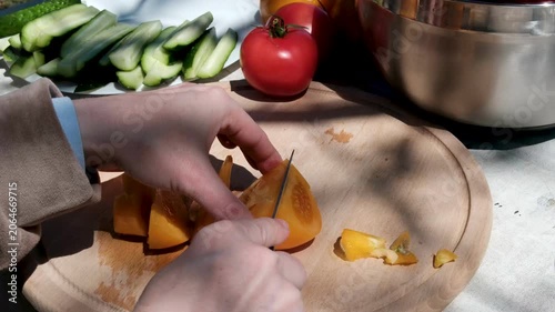 cut the yellow tomato into small cubes. High quality 4k footage