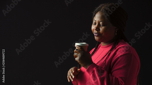 Φωτογραφία African American woman immersed in pleasure of sipping coffee lost in contemplat