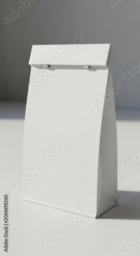 Minimalist White Paper Bag with Folded Top and Metal Clips.