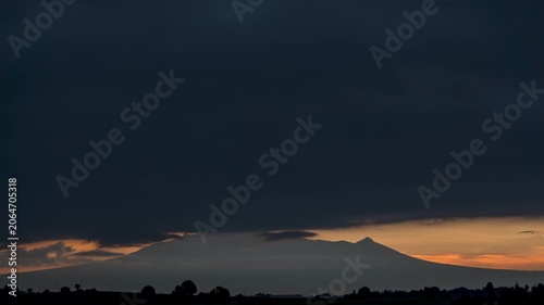 Golden sunrise revealing malinche volcano in mexico
