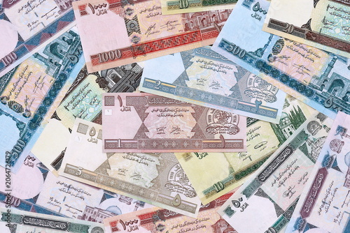 фотографія Afghan afghani money bills pile on table