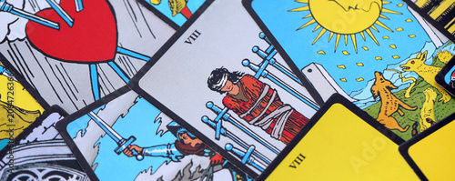 Fotografía Tarot cards spread on a wooden table for divination and fortune telling