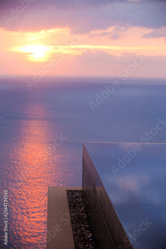 Sunset View Over Infinity Pool in Luxury Hotel Resort in Phuket Thailand