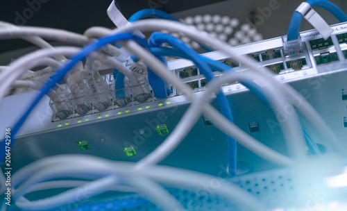Fotografie Network switch and ethernet cable in data center