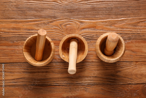 Three wooden mortar and pes...
