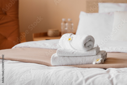 Fresh white towels with plu...