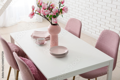 Vase with artificial magnol...