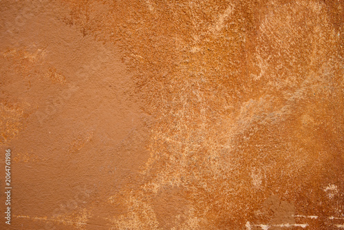 Weathered Orange Plaster Wall Texture Background with Grunge Rough Surface Detail