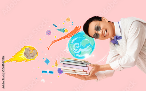 Young Asian man with notebo...