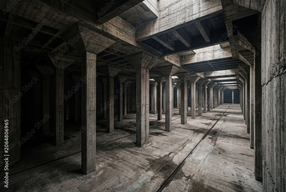 Naklejka premium Vast subterranean brutalist concrete space with columns and long pathways