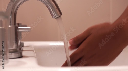 Man washing hands with soap.