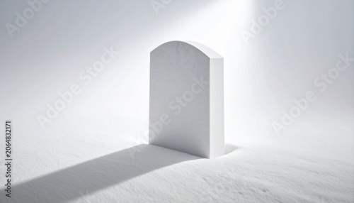 Minimalist White Tombstone in Snowy Landscape