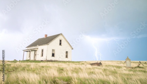 Abandoned Farmhouse Under Stormy Sky