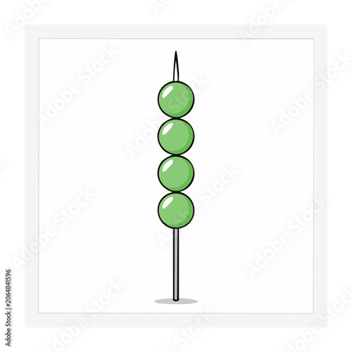 Green skewer with three round items on a stick