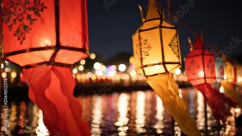 Traditional colorful paper lanterns glowing at night.