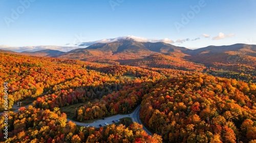 Aerial View of Vibrant Autumn Foliage and Mountain Peaks at Sunset