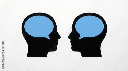 Two heads facing each other in profile with speech bubbles