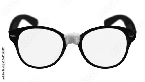 фотографія Broken black eyeglasses repaired with white medical tape isolated on transparent