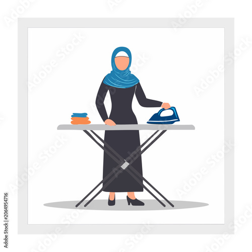 Woman in hijab ironing clothes on ironing board
