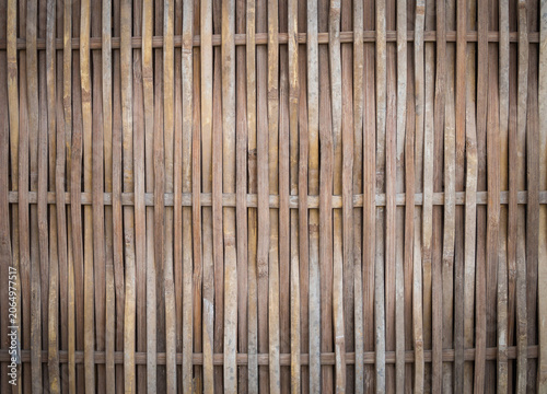 Vertical woven bamboo texture background, rustic bamboo fence wall.