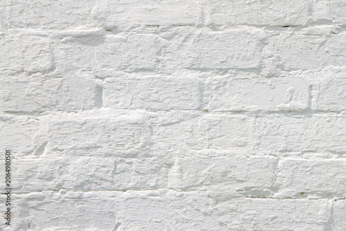 White brick wall texture. Painted masonry background for interior design. Abstract surface pattern for construction and architecture projects.