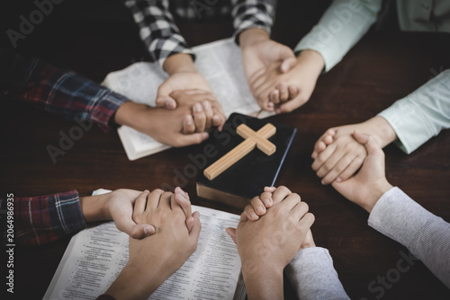 Fotografie Group prayer and Bible fellowship with hands joined together