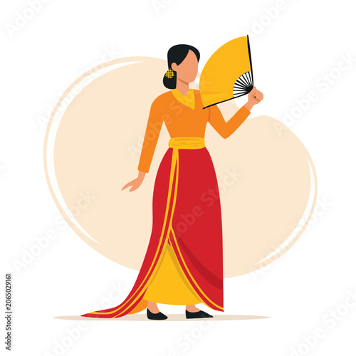 Woman in traditional dress holding a yellow fan