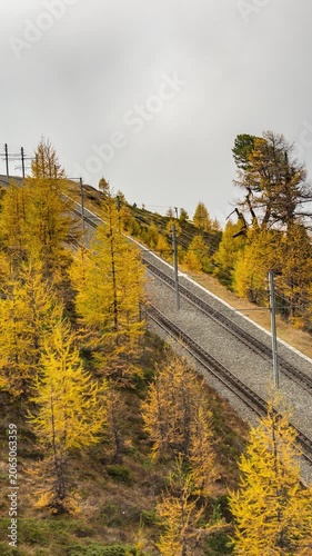 Zermatt Switzerland time lapse of Matterhorn mountain peak and Gornergrat bahn train in Autumn Season (Vertical)