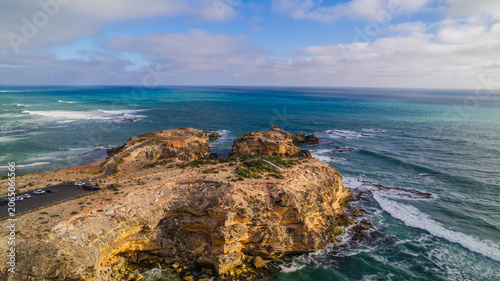 Aerial view of the Cape Northumberland coastline at Port Macdonnell, South Australia, revealing rugged shorelines, dark volcanic rock formations, and deep blue Southern Ocean waters shaped by wind and