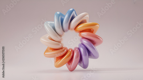 A circular torus shape made of interconnected glossy segments in pastel colors including blue, pink, and orange on a light neutral background