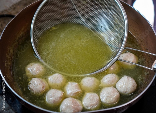 Cuadro en lienzo Homemade Noodle Preparation | Blanching Pork Meatballs in Hot Water