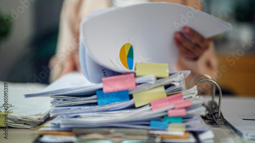 Photos Hands hold a document with colorful sticky notes