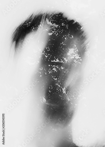 Conceptual monochrome double exposure portrait of human silhouette mixed with foliage texture inspiring psychological identity and memory layouts