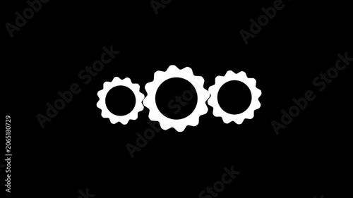 A trio of white gear wheels turning on a black background, representing concepts of industry, mechanics, and continuous operation in motion footage.