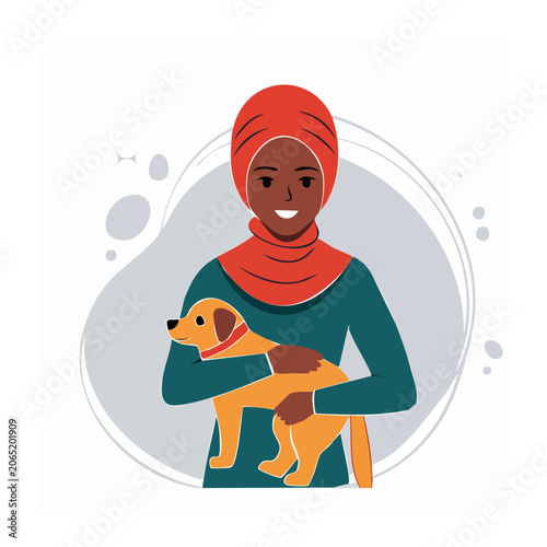 Woman in hijab holding a dog