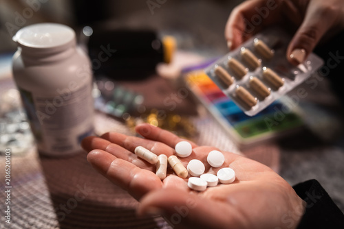 Quadro su tela Taking pills at home for flu, cold, depression, pain relief and general health