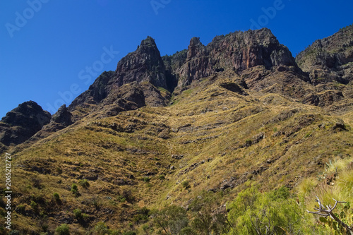 Views along the scenic hiking trail ascending from San Pedro,descending from the high threshing ground Era de Berbique toward the coastal village of Puerto de las Nieves in northwest Gran Canaria, Can