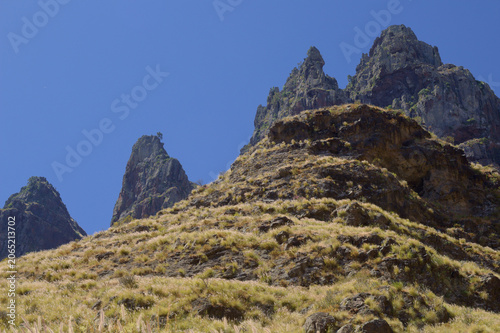 Views along the scenic hiking trail ascending from San Pedro,descending from the high threshing ground Era de Berbique toward the coastal village of Puerto de las Nieves in northwest Gran Canaria, Can