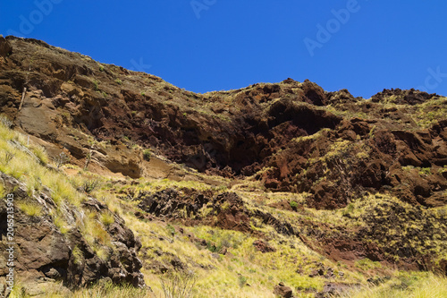 Views along the scenic hiking trail ascending from San Pedro,descending from the high threshing ground Era de Berbique toward the coastal village of Puerto de las Nieves in northwest Gran Canaria, Can