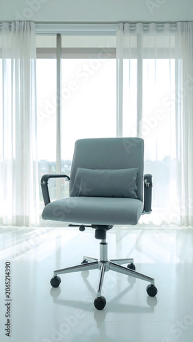 Creative design studio with a light gray ergonomic office chair featuring a soft lumbar cushion, set in an airy modern workspace. 