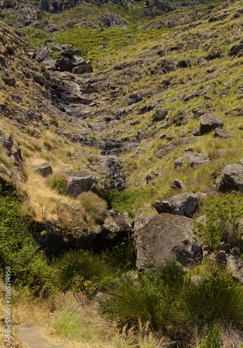 Views along the scenic hiking trail ascending from San Pedro,descending from the high threshing ground Era de Berbique toward the coastal village of Puerto de las Nieves in northwest Gran Canaria, Can