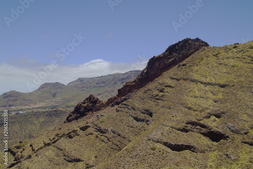 Views along the scenic hiking trail ascending from San Pedro,descending from the high threshing ground Era de Berbique toward the coastal village of Puerto de las Nieves in northwest Gran Canaria, Can