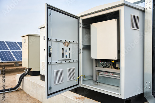 Εκτύπωση καμβά Solar power inverter cabinet with open door showing electrical components and so
