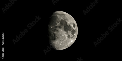 Moon surface textures visible on a smooth black background