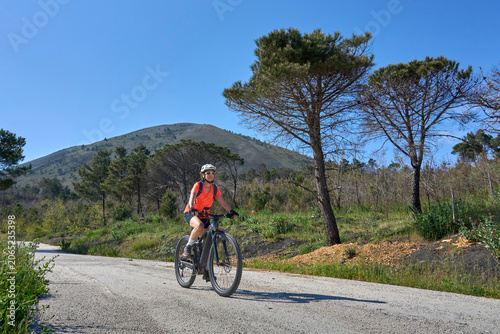 Active senior woman riding ...