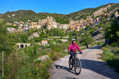 Active senior woman riding ...