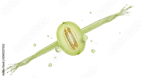 Distant shot of a melon slice with a sharp diagonal green juice jet stream behind it