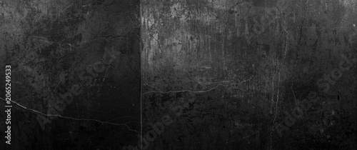 Textured dark concrete wall surface with scratches and cracks